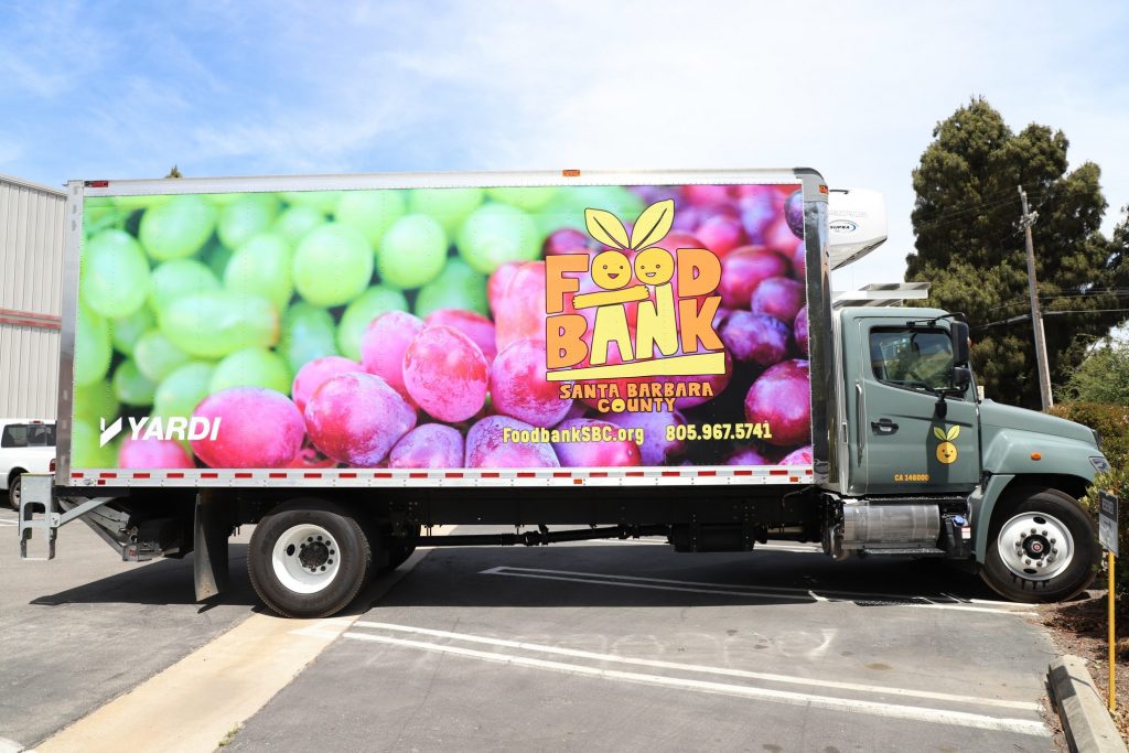 A delivery truck wrapped in a vehicle graphic