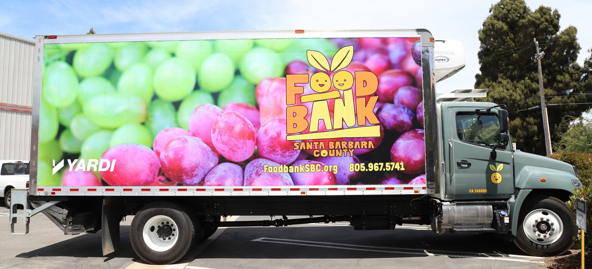 A delivery truck with a vehicle wrap on it