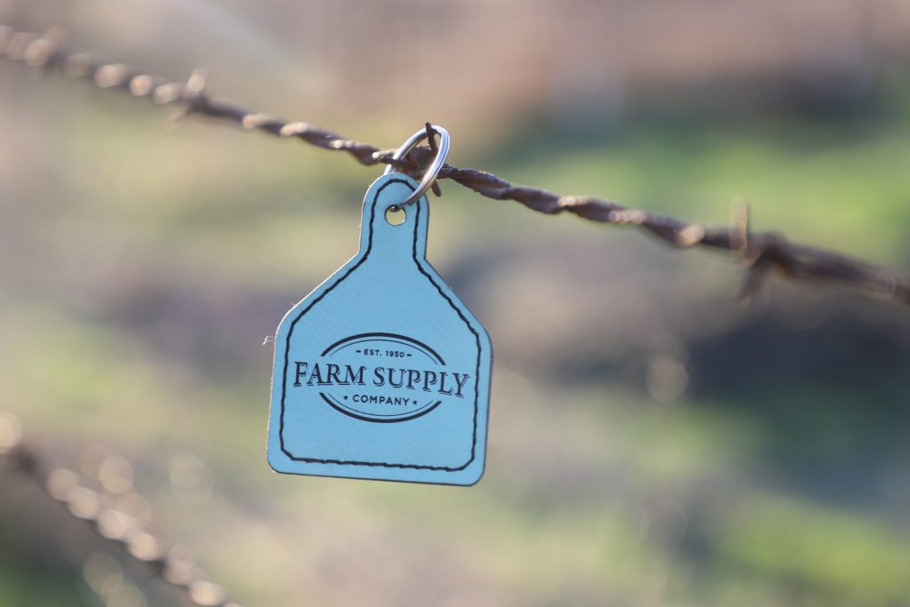 Farm supply ear tag keychain
